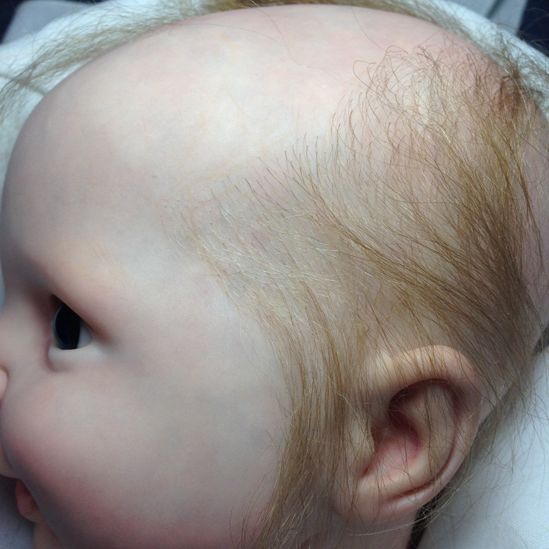 Lifelike Reborn baby doll rooted ruby red mohair hairline